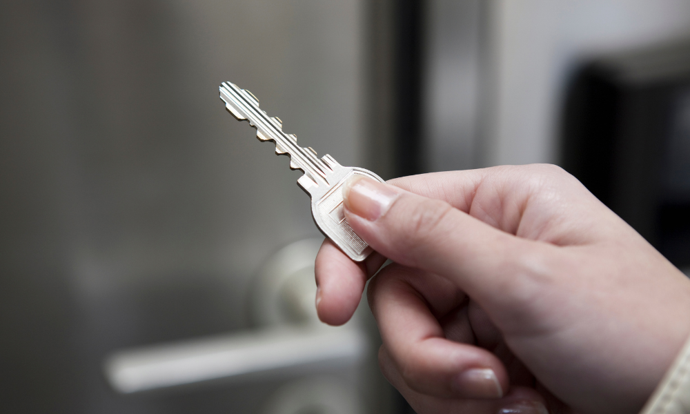 key management person holding key